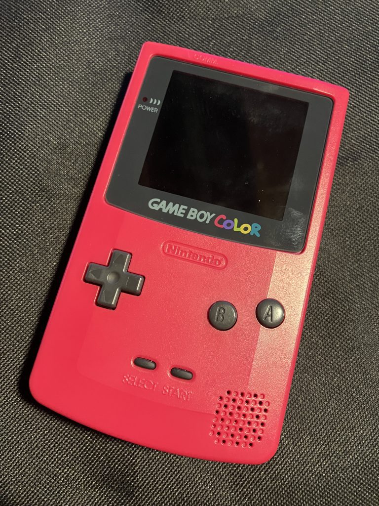 A Cherry Red Game Boy Color with a large IPS display.