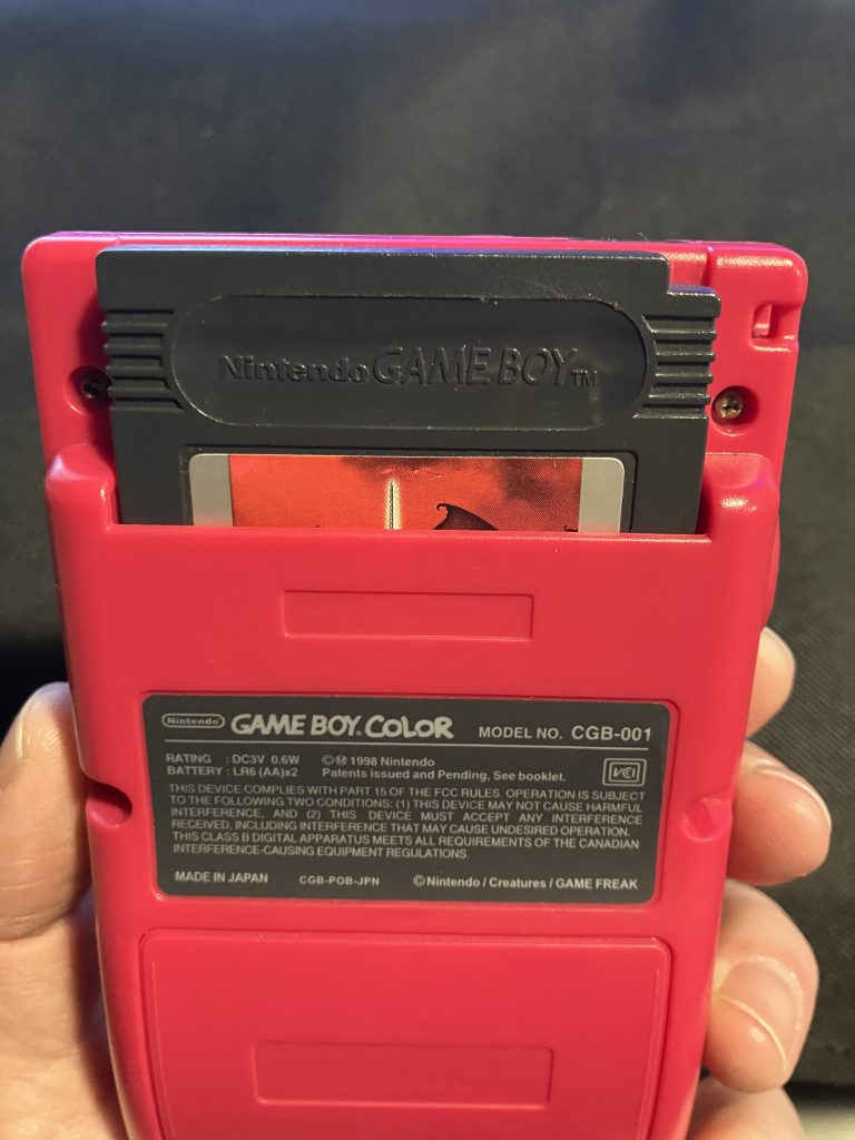 A Game Boy game correctly inserted into a Game Boy.